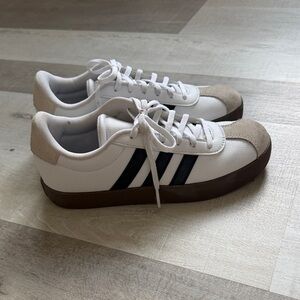 Adidas White Sneakers with Black Stripes and Brown Sole